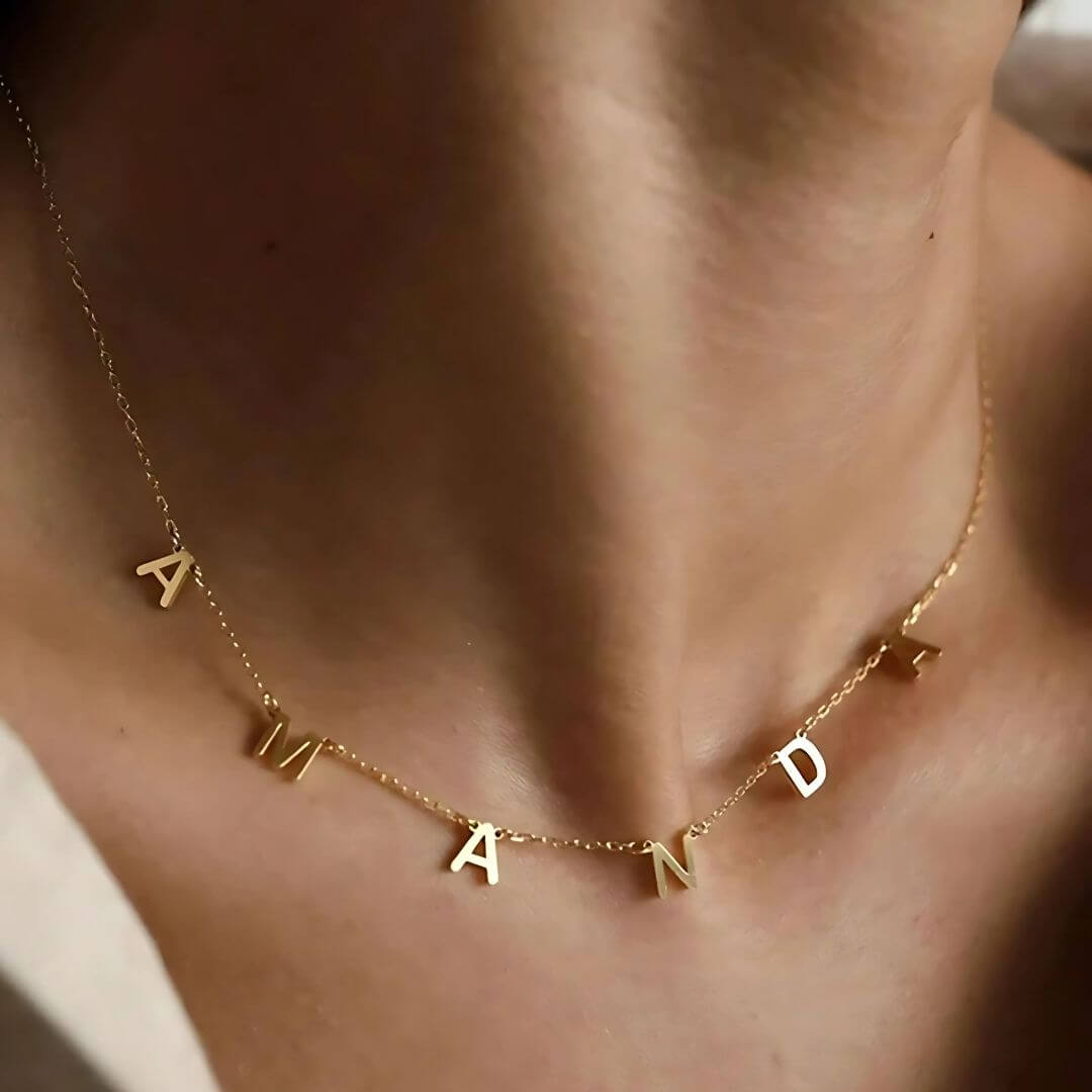 Dainty gold letter name necklace spelling 'Amanda,' perfect for personalizing your jewelry collection.