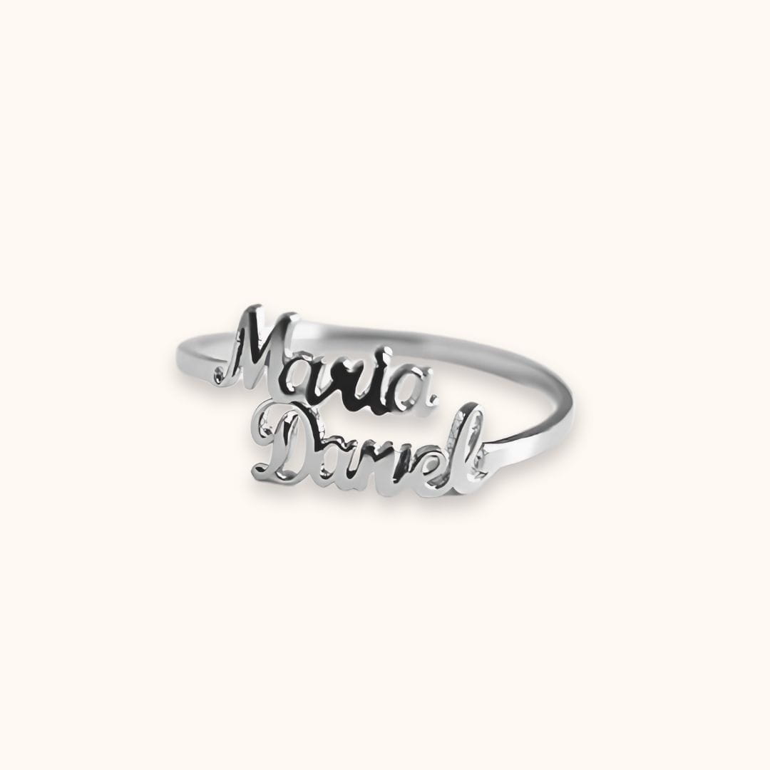 Silver custom double name ring with 'Maria' and 'Daniel,' a timeless accessory for meaningful connections.