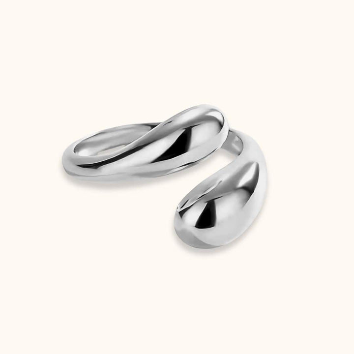 Close-up of Open Teardrop Dome Ring in sleek silver, highlighting its minimalist and adjustable design, ideal for stacking and statement looks.