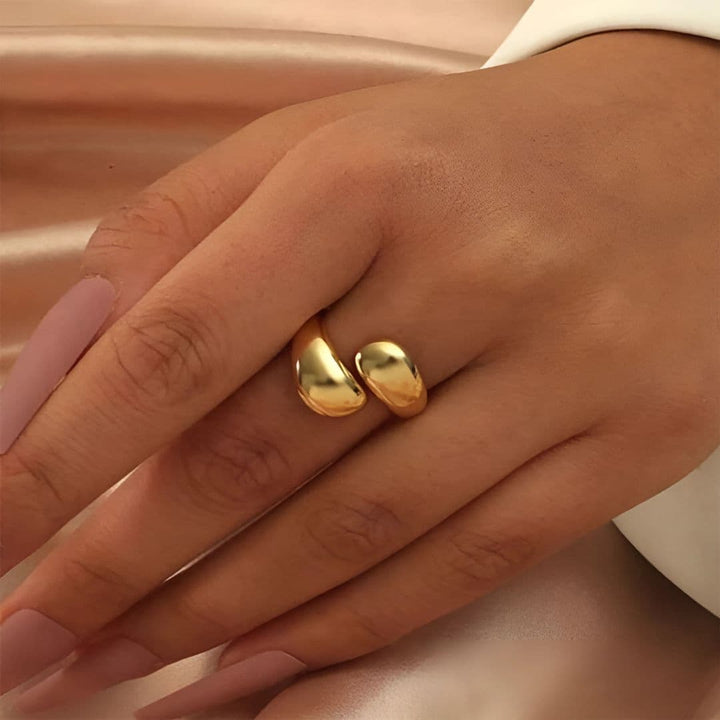 Elegant Open Teardrop Dome Ring in polished gold finish on a model’s hand, showcasing its bold and luxurious design – perfect for everyday wear.